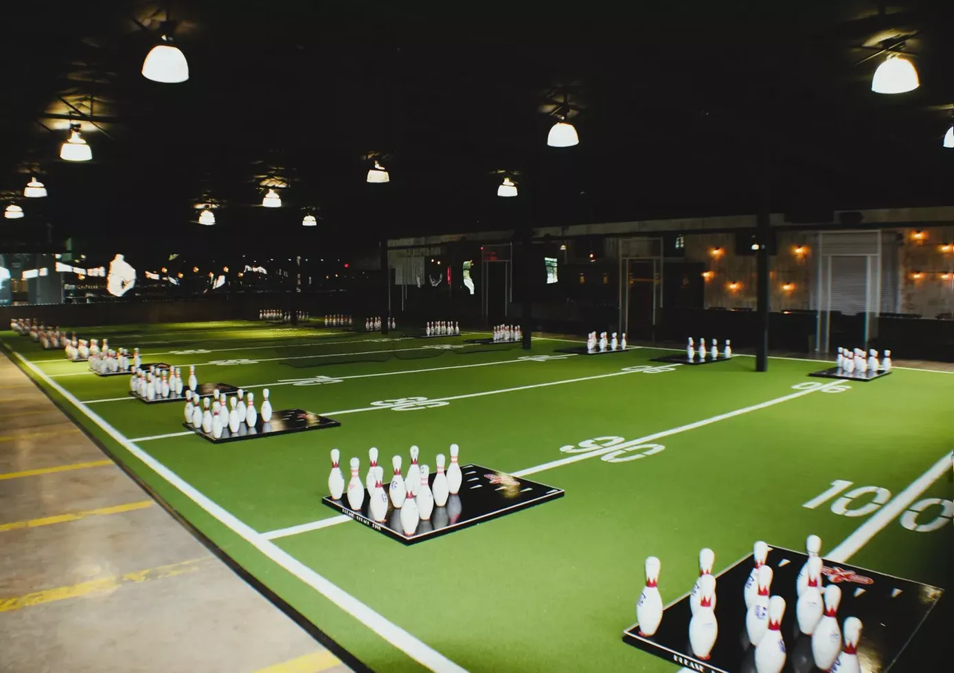 Get ready to toss! This action-packed PinToss field at BowGames brings friends together for competitive fun, food, and drinks.